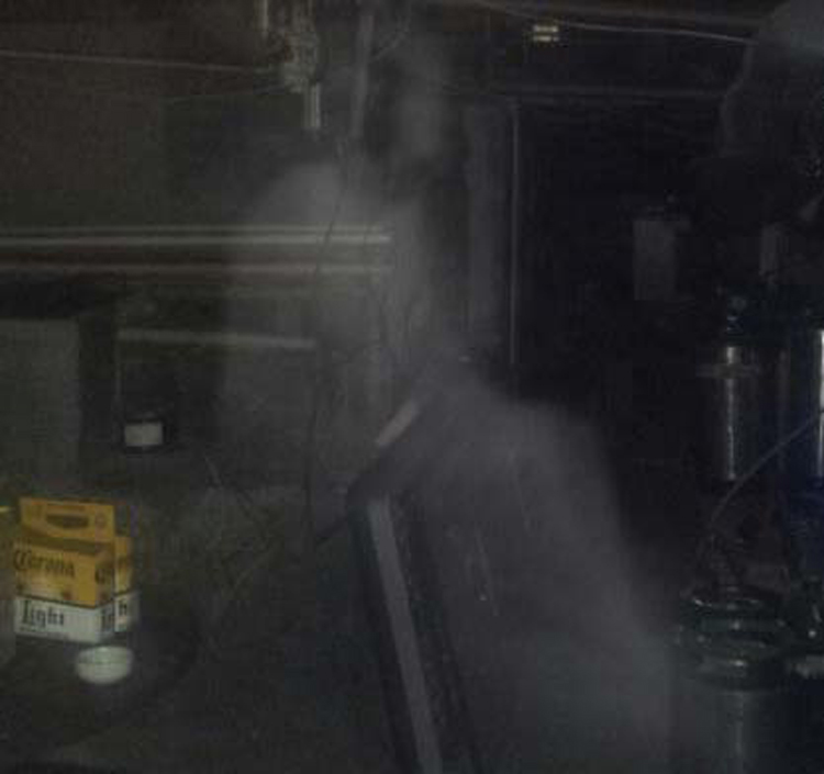 A full-bodied apparition in a basement