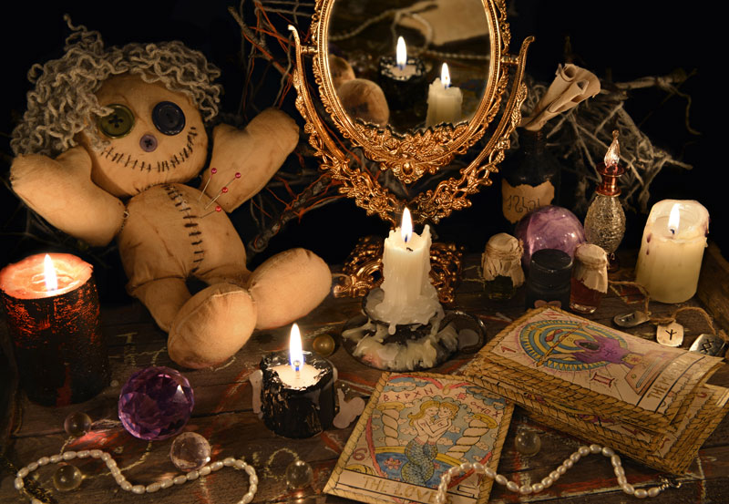 Root Magic Conjure, spellwork voodoo doll, tarot cards and candles