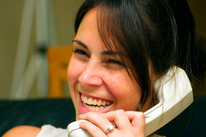 Karen Hollis reads by telephone for clients who are not in the Connecticut region.