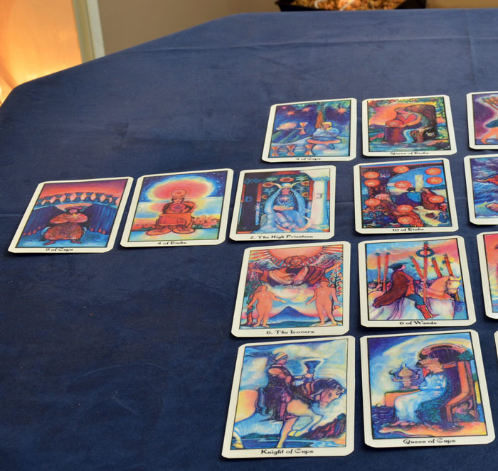 Close-up shot of Tarot cards spread, which gives Karen insight into your life