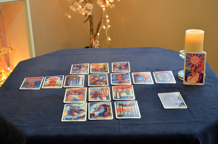 Tarot cards laid out in a classic spread on Karen's table