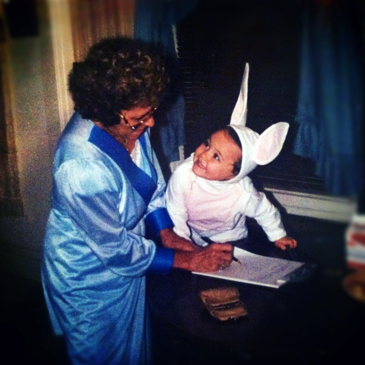 Woman with child in a rabbit costume with large ears